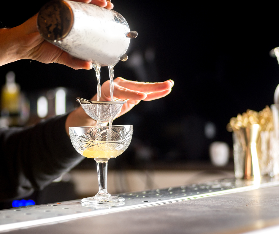 cocktail-poured-over-strainer